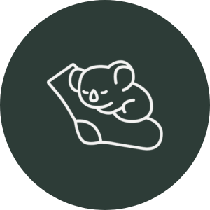 White outline of a baby elephant on a dark green circle