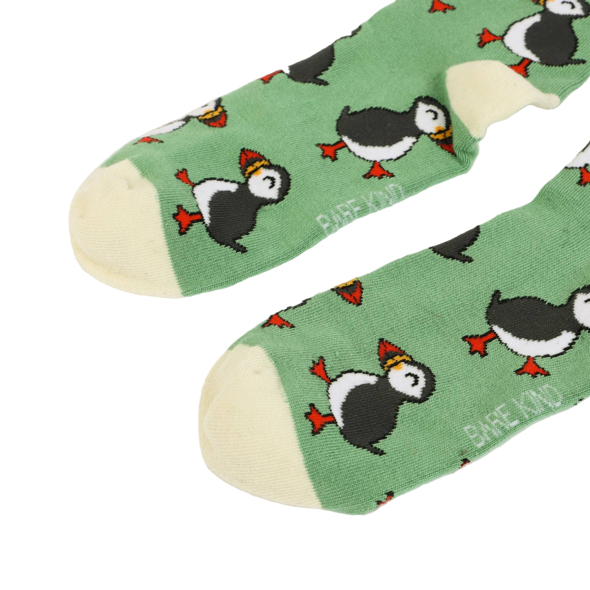 Green socks with puffin pattern on a white background