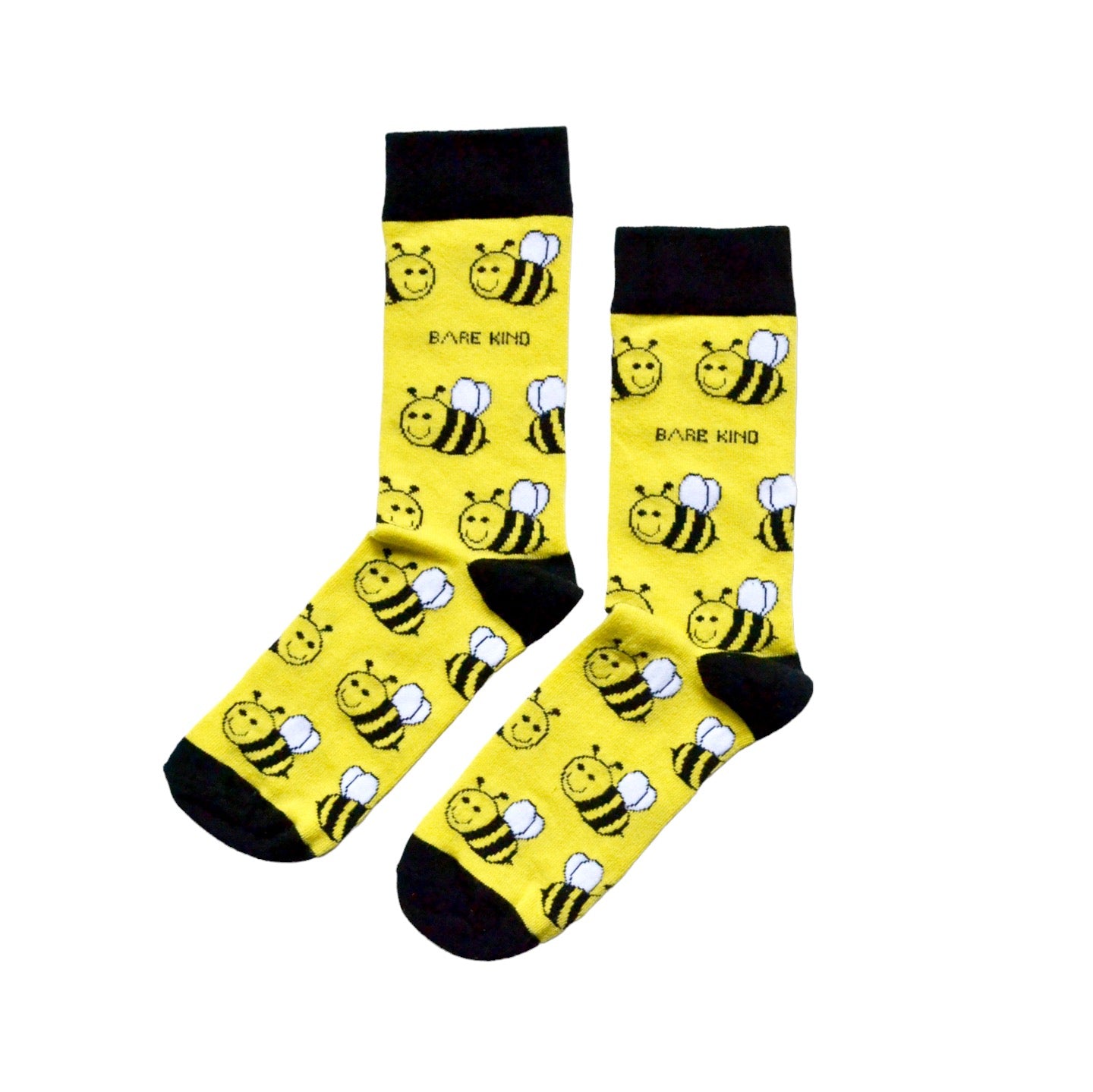 flat lay of black and yellow bee bamboo socks