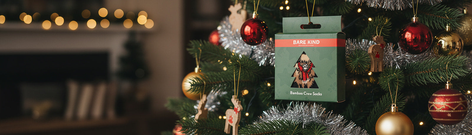 Christmas tree with ornaments and a Bare Kind gift box