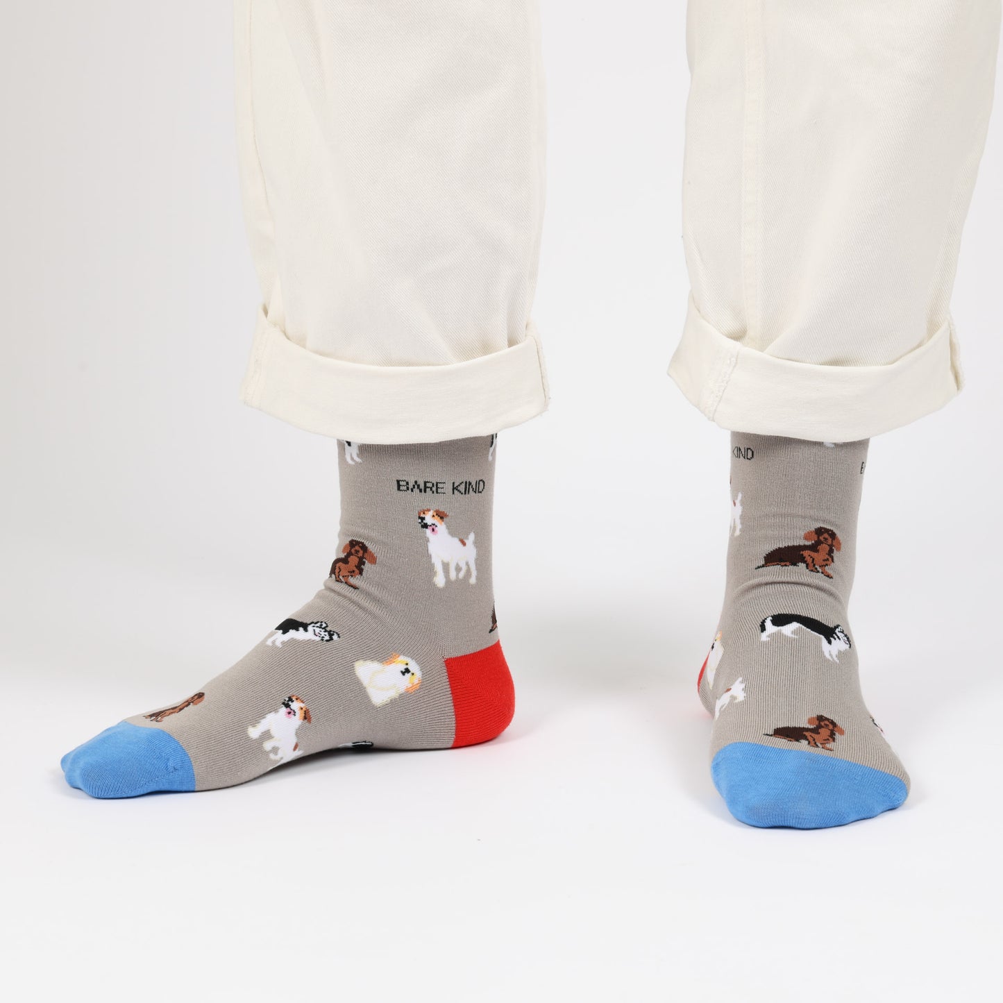 model with white trousers wearing grey dog bamboo socks