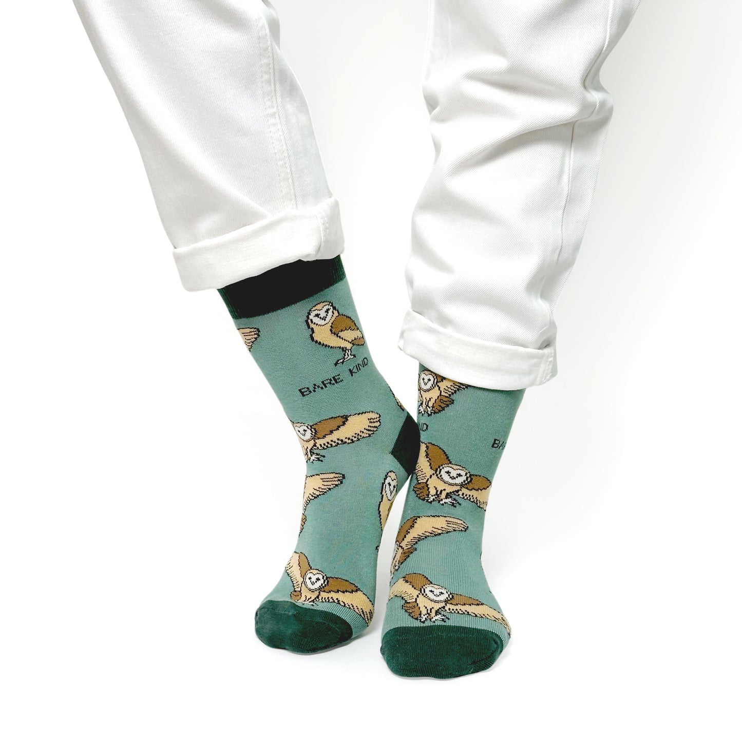 model wearing green barn owl bamboo socks
