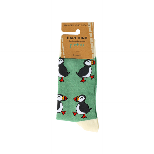 Green socks with puffin design and Bare Kind packaging on a white background