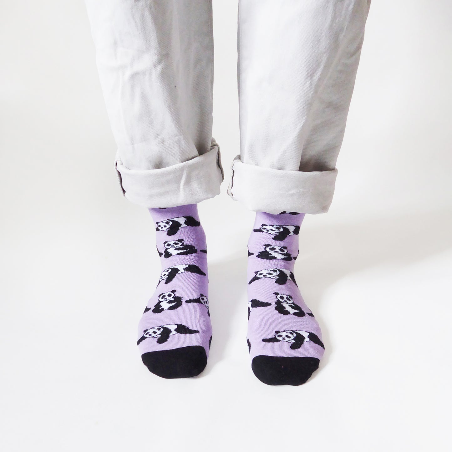 standing model wearing lilac panda socks, front view