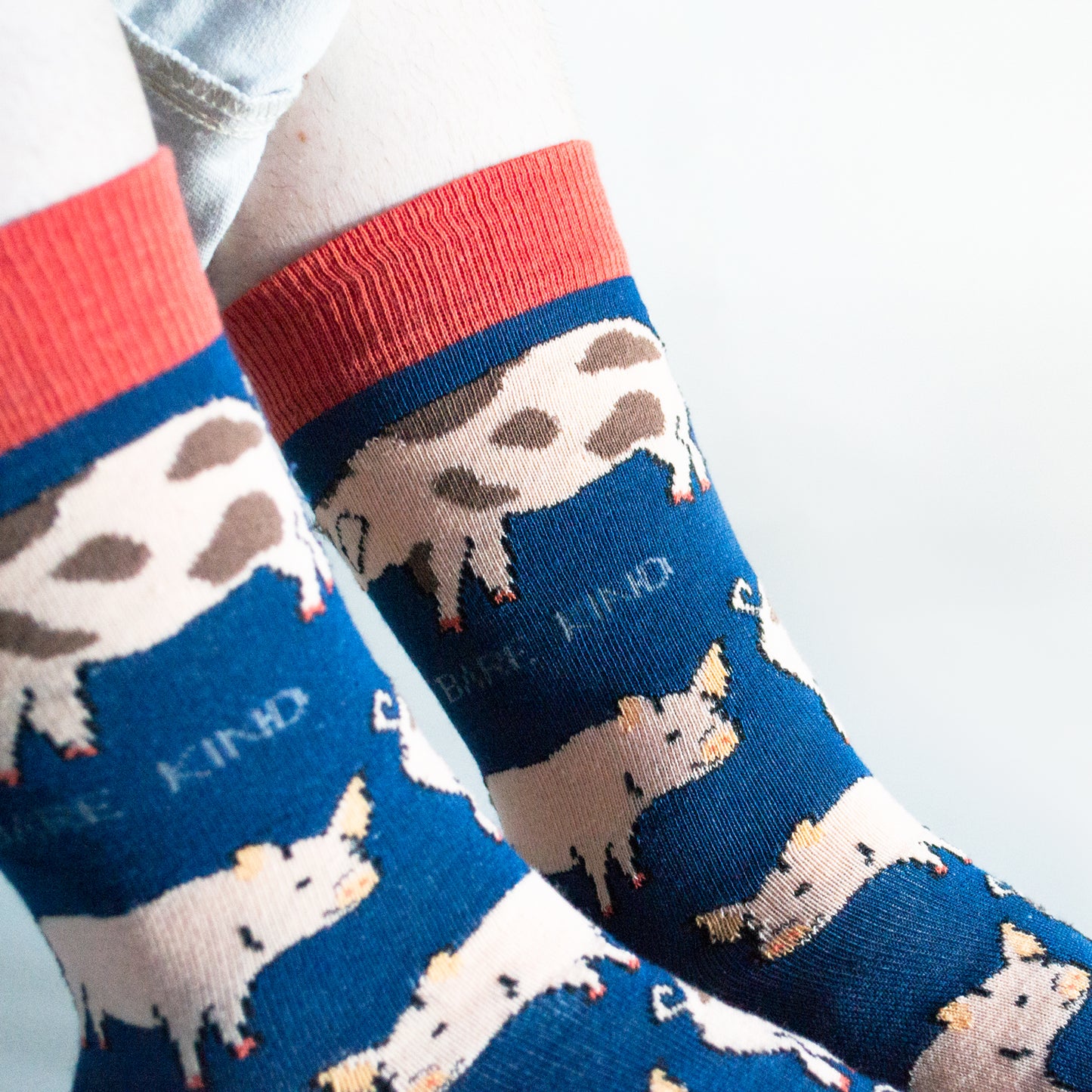 closeup of navy blue bamboo pig socks on model