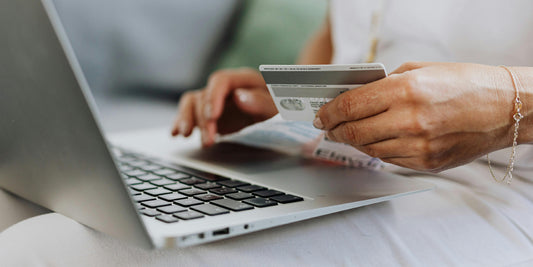 woman shopping online with her credit cart