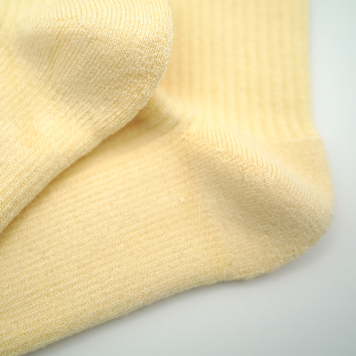 Picture of yellow ribbed bamboo socks showing padded soles