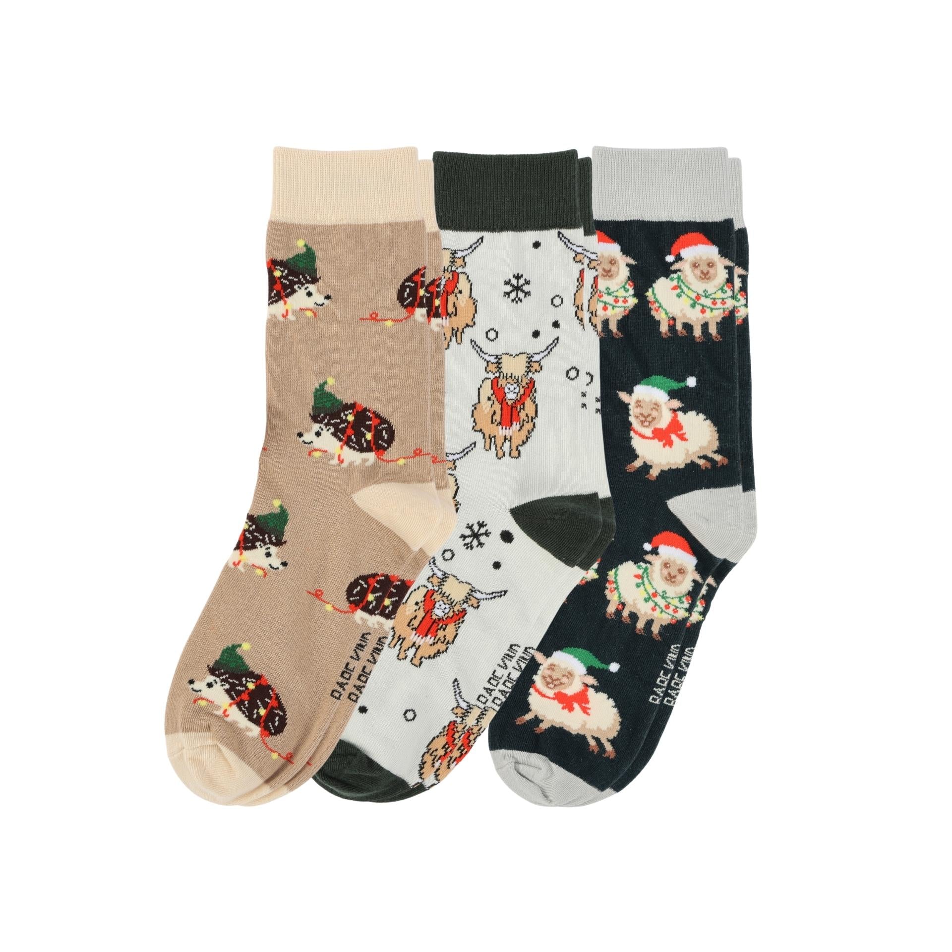 Three pairs of socks with festive animal patterns on a white background
