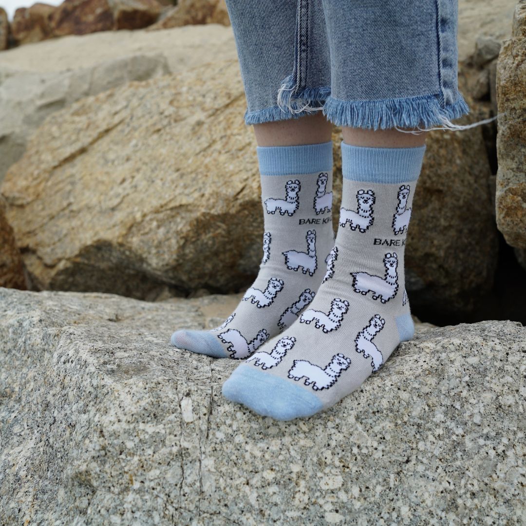 model wearing grey blue alpaca bamboo socks