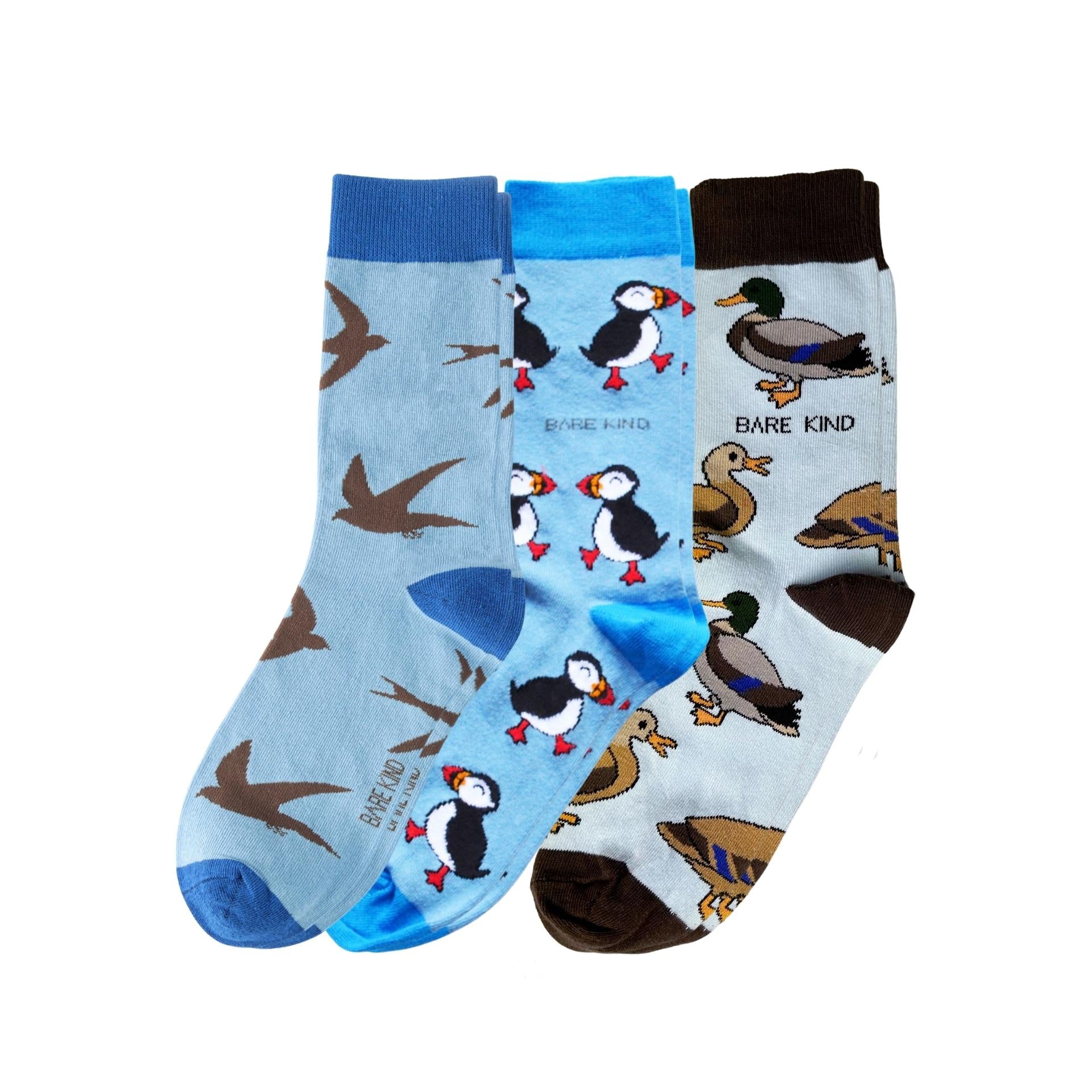 Three pairs of socks with animal patterns on a white background