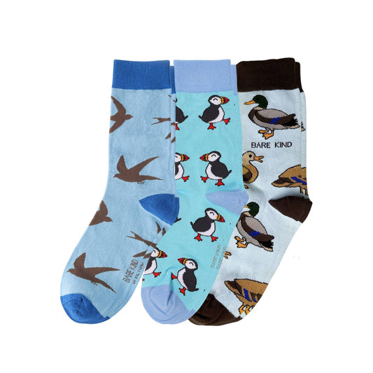 Three pairs of socks with animal patterns on a white background