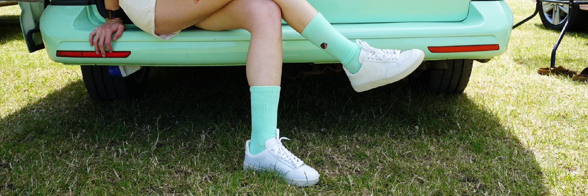 Model wearing green hedgehog ribbed sock