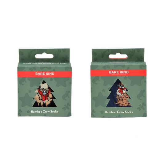 Two packages of Bare Kind Bamboo Crew Socks shown side by side on a plain white background. The packaging is dark green camouflage with a red band and an illustration of a person in a winter outfit.