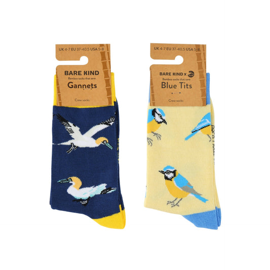 Two pairs of Bare Kind socks displayed side by side on their cardboard hangers against a white background. The left pair is navy blue with a gannet pattern and yellow toes.