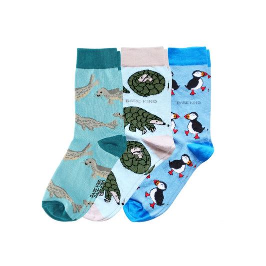 Three pairs of socks with animal patterns on a white background