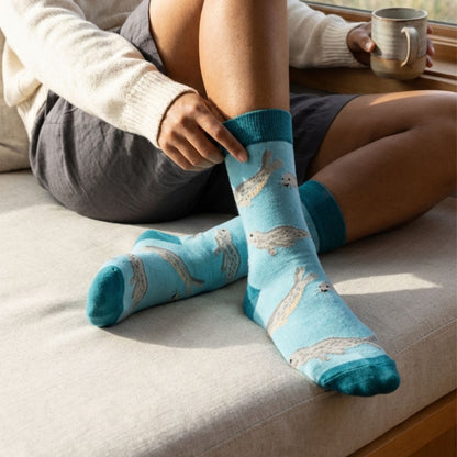 Model wearing blue seal socks