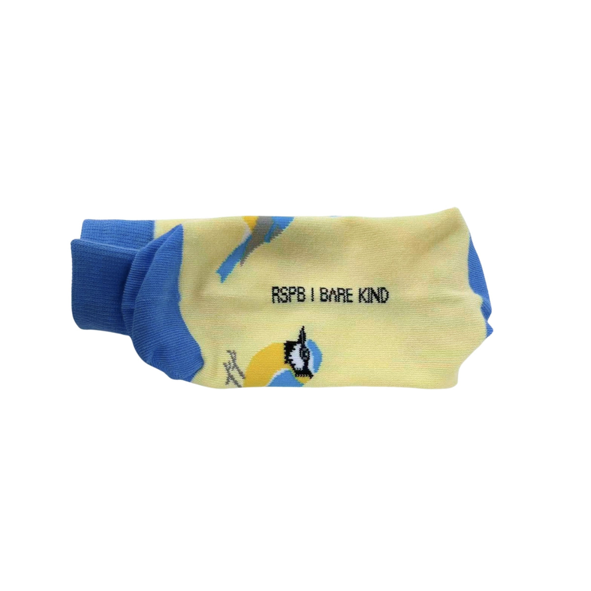 A pair of pale yellow crew socks with blue cuffs and heels, featuring a graphic of a black and white bird and the text 'RSPB | BARE KIND' printed on the side.