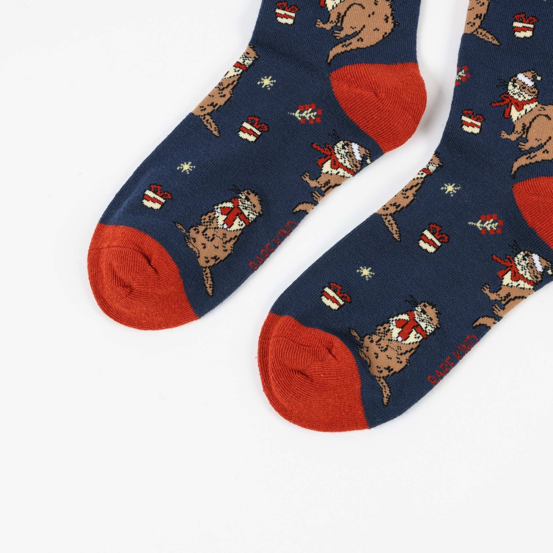 Pair of Christmas Otter socks on a white background