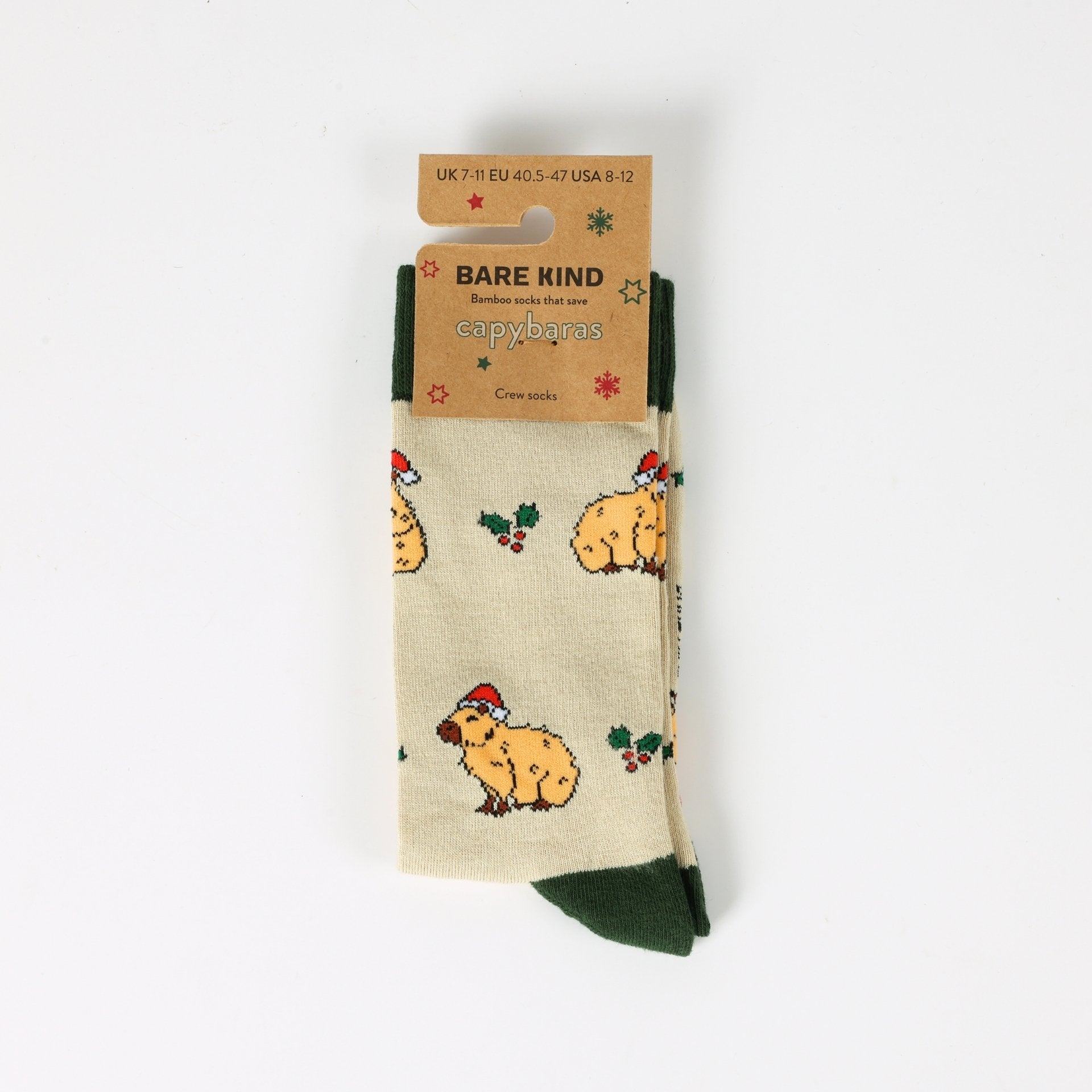 Beige socks with capybara pattern and 'Bare Kind' packaging on a white background