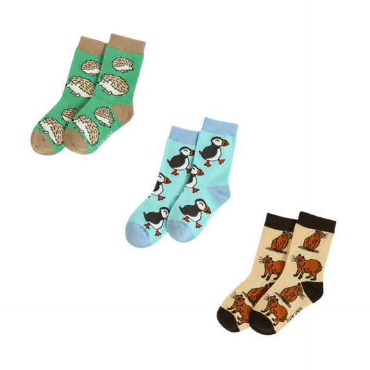 Three pairs of socks with animal patterns on a white background
