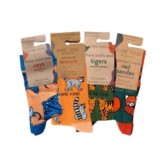 Packaging flat lays of orange rays, lemur, tiger and red panda bamboo socks