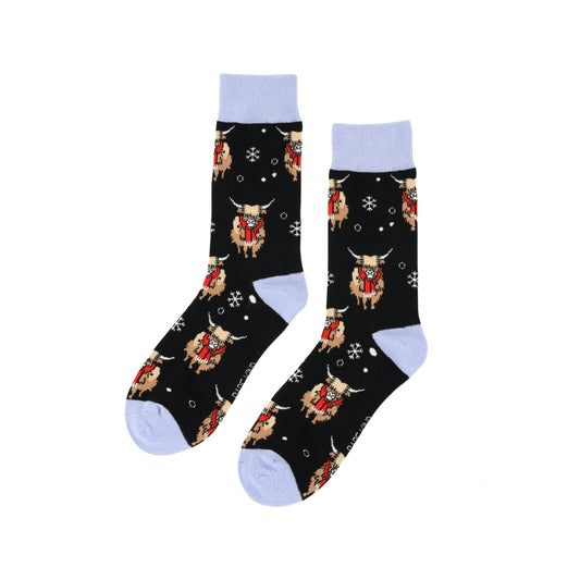 flat lay of christmas highland cows bamboo socks