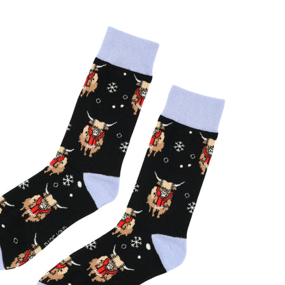 flat lay of christmas highland cows bamboo socks
