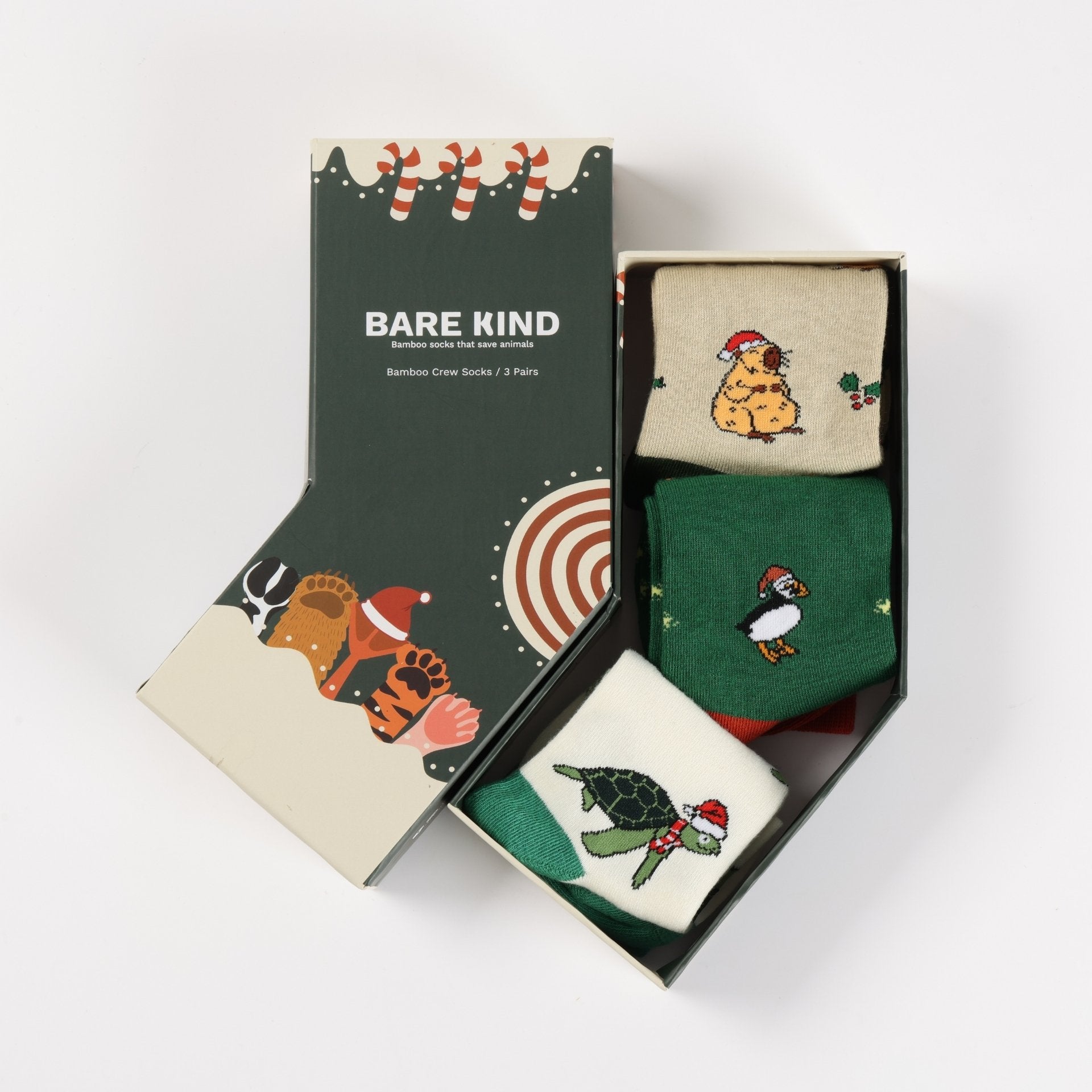 Box of Bare Kind socks with festive designs on a white background