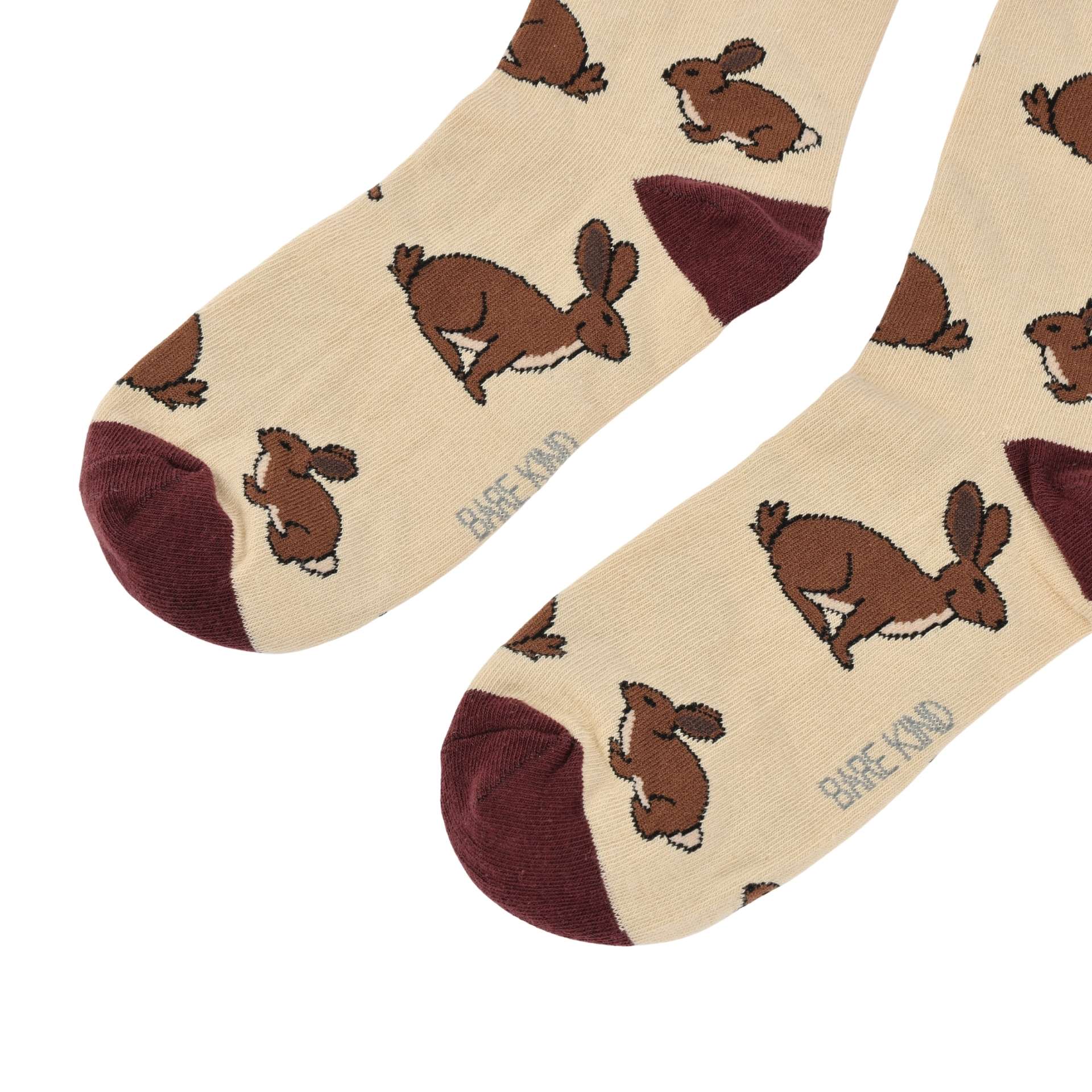 Beige socks with brown hare illustrations 