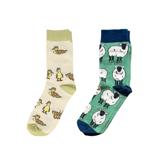 Two pairs of socks with animal patterns on a white background
