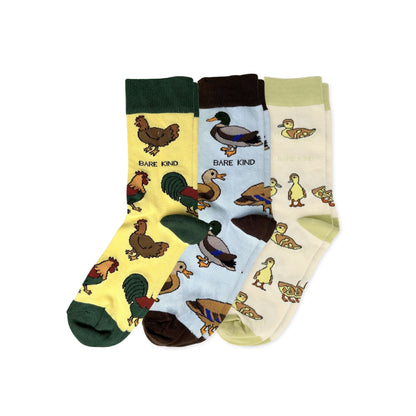 Three pairs of socks with animal patterns on a white background
