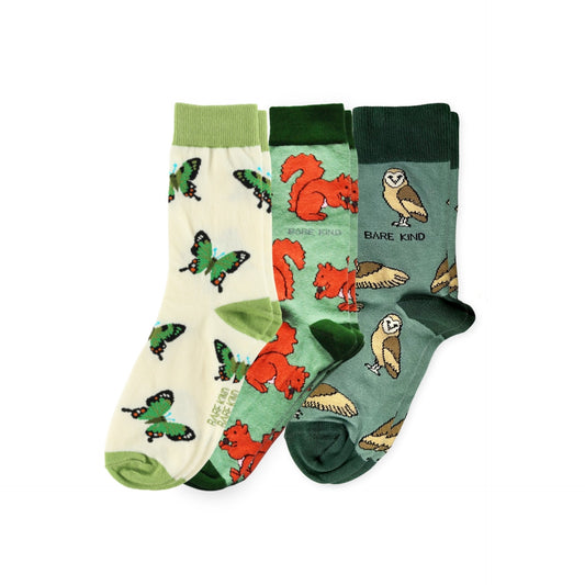 Three pairs of socks with animal prints on a white background