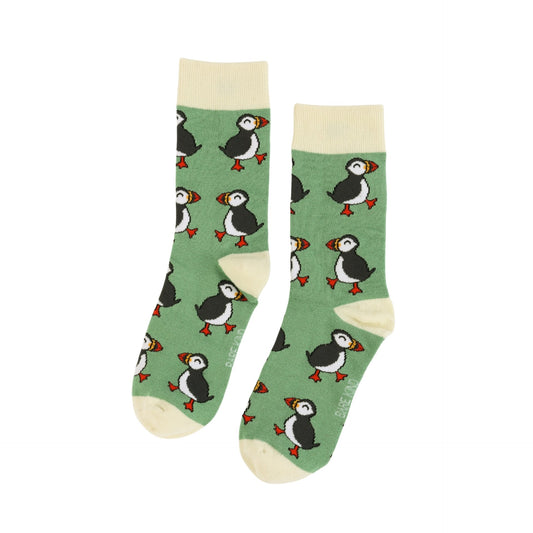 Green socks with puffin pattern on a white background