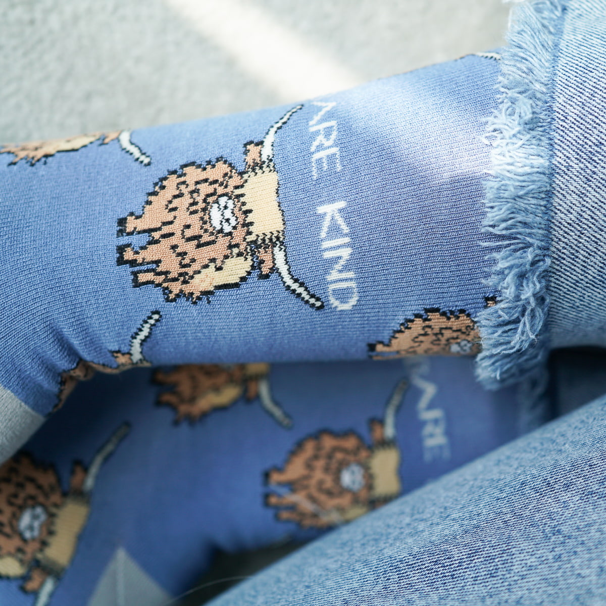 Model wearing highland cows bamboo socks, close up 