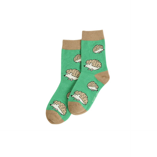 Green socks with hedgehog pattern on a white background