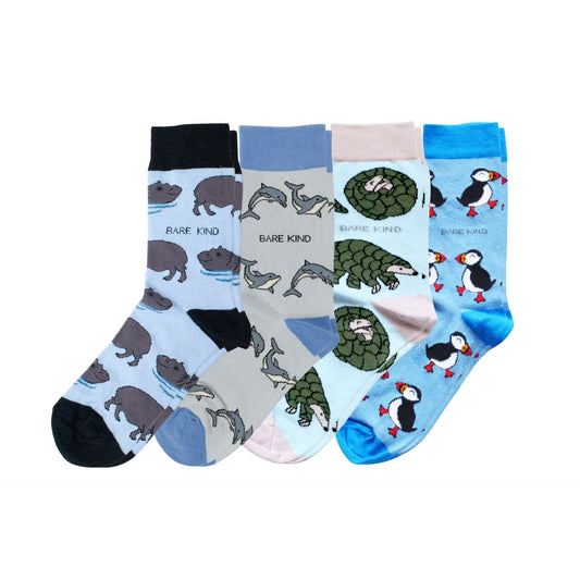 Set of four pairs of socks with animal patterns on a white background
