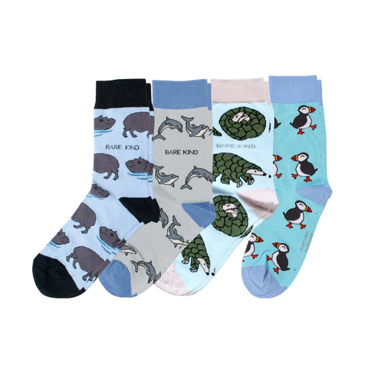 Set of four pairs of socks with animal patterns on a white background