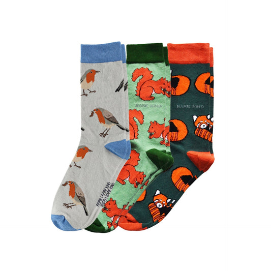 Three pairs of novelty crew socks displayed together on a white background. 