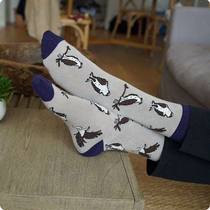 Pair of Osprey bamboo socks on a wooden surface