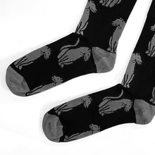 toe closeup flat lay of soft top black panther crew socks for adults