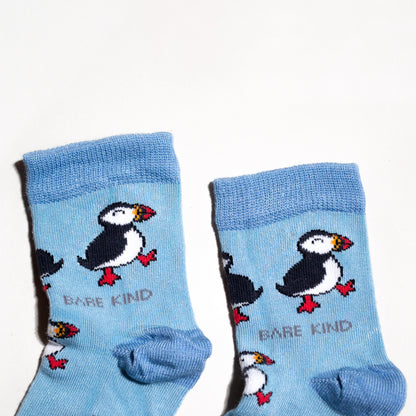 cuff closeup flat lay of blue bamboo puffin socks for kids