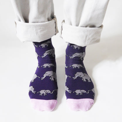 model wearing deep purple bamboo socks with elephant animal design