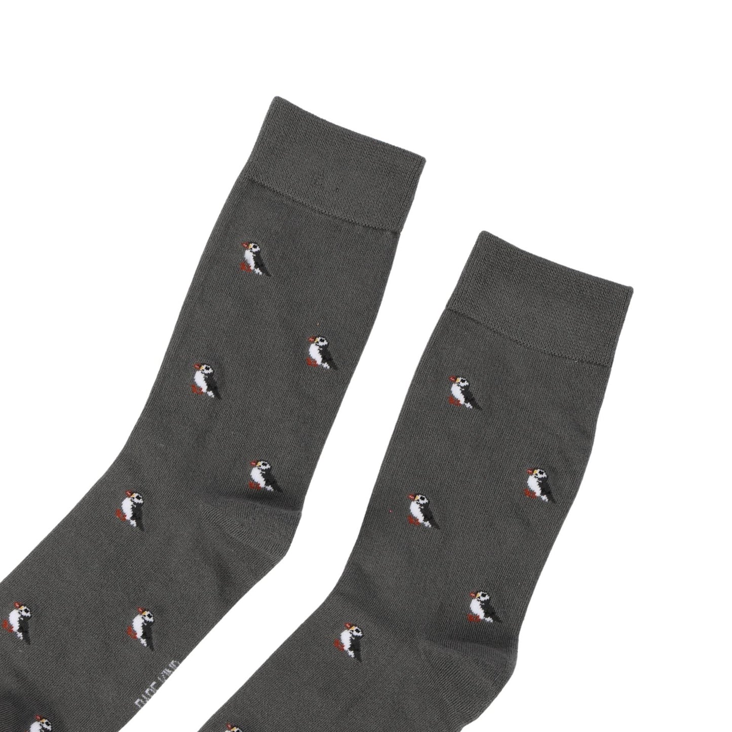 Dark gray socks with puffin pattern on a white background