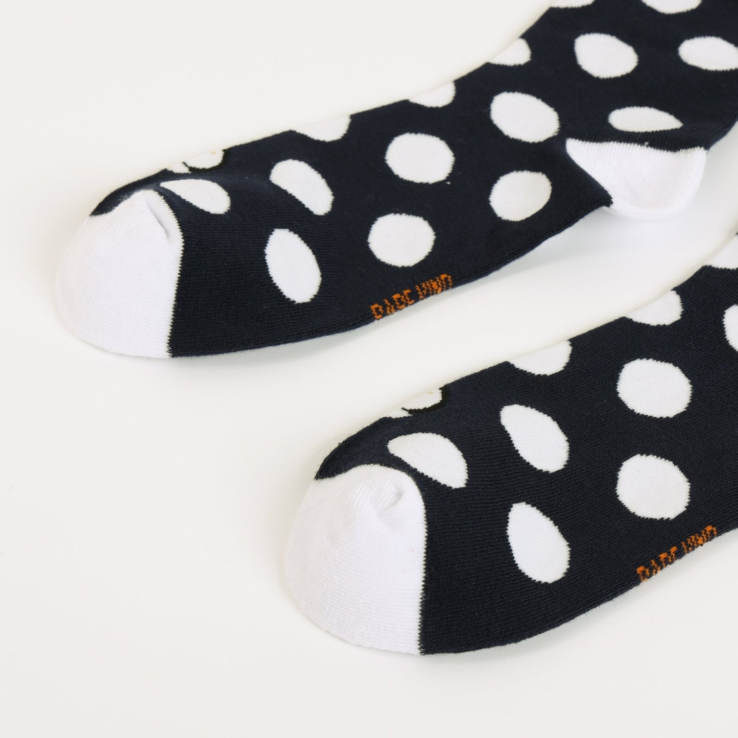 Puffin polka dots socks on a white background