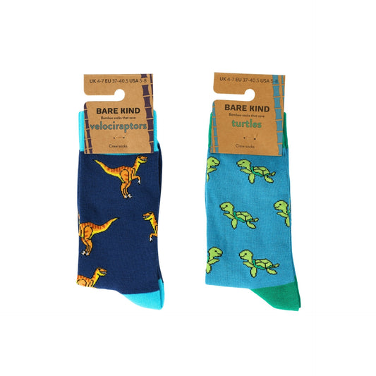 Two pairs of socks with dinosaur and turtle designs on packaging labeled 'Bare Kind'.
