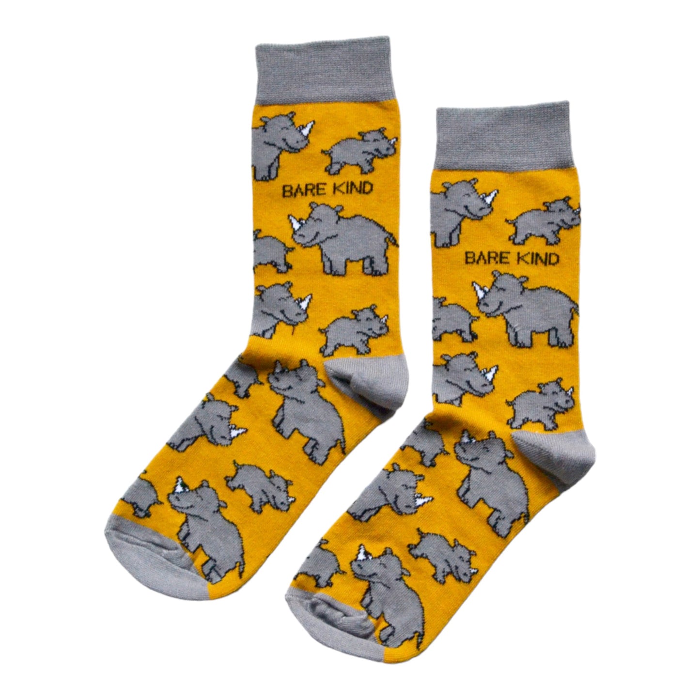 flat lay of mustard yellow bamboo socks with woven rhino design