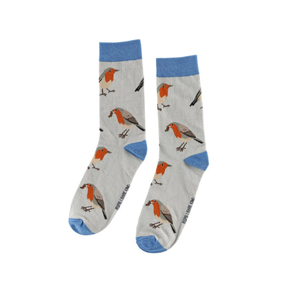 A pair of crew socks with a light gray background featuring a pattern of robin birds and blue accents on the cuffs, heels, and toes.