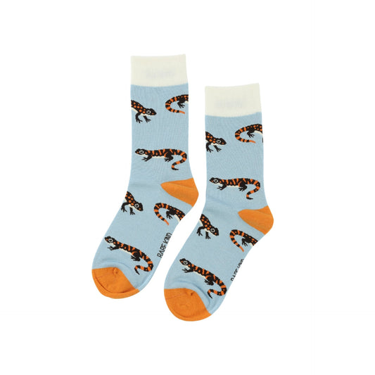 Pair of socks with salamander pattern on a light blue background