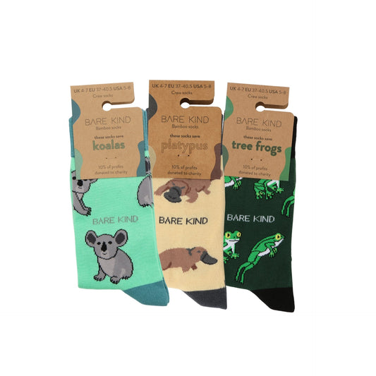 Three pairs of Bare Kind socks with animal designs on packaging