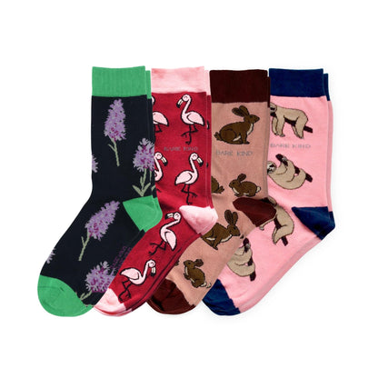 Four pairs of socks with different designs on a white background